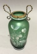 A green decorative glass vase
