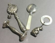 Four silver rattles