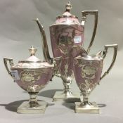 A silver overlay porcelain tea set