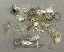 A quantity of silver charms, etc.