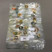 A collection of golf related lapel pin badges