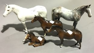 A Beswick Grey Horse together with another Flea-bitten Grey Horse and two further Beswick horses,