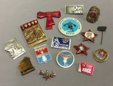 A box of Russian Soviet enamel badges, etc.