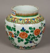 A Chinese Wucai porcelain vase Polychrome decorated with floral sprays within lappet bands,