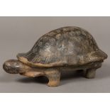 A South American antiquity model of a tortoise Typically modelled, standing on all fours.