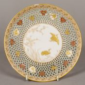 A fine quality Royal Worcester Aesthetic Movement reticulated plate attributed to GEORGE