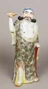 A Chinese porcelain figure of a sage Modelled holding aloft a double gourd,