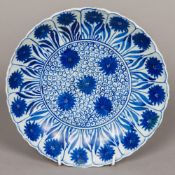 A Chinese blue and white porcelain dished plate Worked with floral sprays within a lappet border