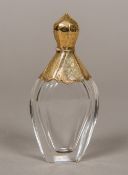 A 19th century unmarked gold mounted clear glass scent bottle Of chamfered flattened form,
