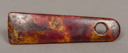 A Chinese carved russet jade pendant 10.5 cm long.