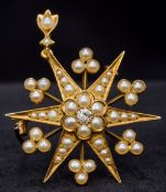 A Victorian unmarked gold, diamond and seed pearl set pendant/brooch Of star burst form. 4.