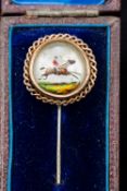 A Victorian stick pin Set with an Essex crystal roundel decorated with a galloping horse with