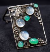 An Arts & Crafts unmarked silver moonstone and chrysoprase clip,
