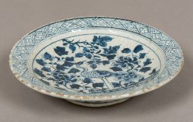 A Chinese blue and white porcelain dish Centrally decorated with a crane in a garden landscape.