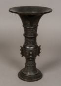 A Chinese antique patinated bronze vase Of tall slender flared form,