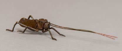 A Japanese bronze articulated grasshopper Naturalistically cast, impressed mark.