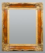 A 19th century gilt and rosewood framed wall glass The rectangular plate bevelled.