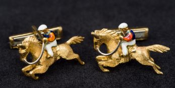 A pair of 18K gold and enamel cufflinks Each formed as a racehorse with jockey up. Each 2.