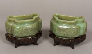 A pair of Chinese jade vases Each of squat triple lobed form with foliate carved panels,