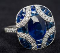 An Art Deco sapphire and diamond set platinum ring Cruciform set.