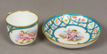 A late 18th century Sevres porcelain cup and saucer Each painted with a vignette of cupid amongst a