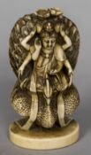 A Chinese carved ivory group Worked as a multi-armed deity riding a peacock,