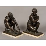 A pair of 19th century patinated bronze classical figures Each crouching, one male,