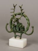 A Chinese cast bronze archaistic group Worked as a stag flanked with rams,