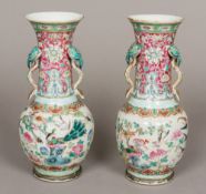 A pair of 19th century Chinese famille rose vases Each elongated flared neck with a twin ruyi