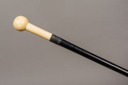 A Victorian silver collared marine ivory handled walking stick The plain knop handle above the