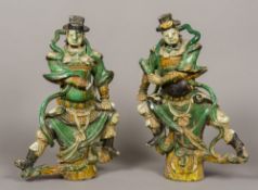 A pair of 17th/18th century Chinese glazed pottery figural roof tiles Each formed as a warrior.