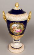 A 19th century Berlin porcelain twin handled vase and cover Well painted with a bacchic vignette