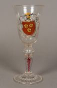 A 19th century enamel decorated air twist stem glass The flared bowl decorated with an heraldic