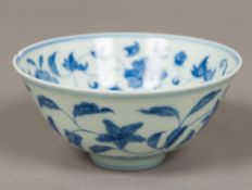 A Chinese blue and white porcelain bowl Decorated with flowering vines,