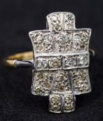 An Art Deco style 18 ct gold diamond set ring 2.25 cm high.