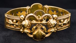 An antique 18 ct gold bracelet Of pierced hinged form,