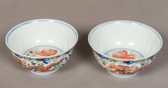 A pair of Chinese porcelain bowls Polychrome decorated with dragons interspersed with phoenixes,