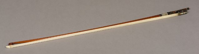 A 19th century German violin bow, stamped Albert Fischer 74 cm long.