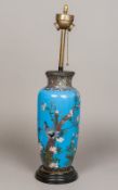 A Chinese cloisonne lamp base With twin fitting, the vase worked with birds amongst foliate sprays,