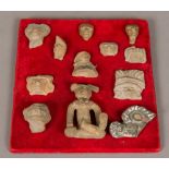 A collection of twelve small South American antiquity fragments and pieces Various designs and