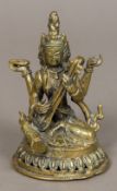 A Chinese cast bronze figure of a deity Worked playing a stringed instrument,