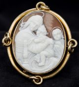 A good quality gold mounted carved cameo brooch Carved with the Virgin Mary and the Christ child