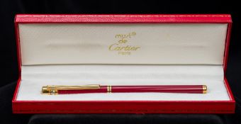 A Must de Cartier fountain pen With 18 ct gold nib, numbered 024560, cased. 13.5 cm long.