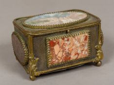 A late 19th century Continental gilt metal casket The hinged cover inset with an architectural