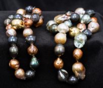 A Chinese freshwater baroque lustre pearl necklace In two parts, the clasps magnetic.