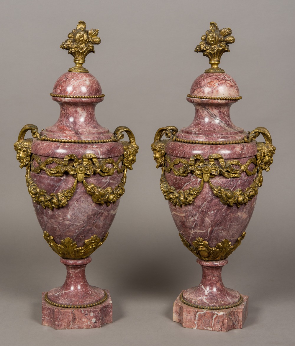 A pair of French bronze mounted variegated purple marble urns Each with twin horned mask handles