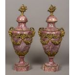 A pair of French bronze mounted variegated purple marble urns Each with twin horned mask handles