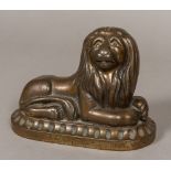 A 19th century cast iron doorstop Modelled as a recumbent lion with allover bronzed finish.