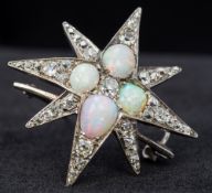 A Victorian unmarked opal and diamond brooch Of star burst form. 3.5 cm wide.