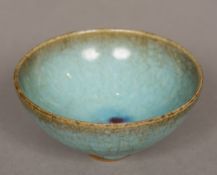 A Chinese Song type porcelain bubble bowl Of conical form with typical glaze. 9.5 cm diameter.